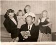 dad reading to family.jpg