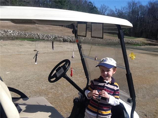 Spencer playing golf with Catherine and candy.jpg